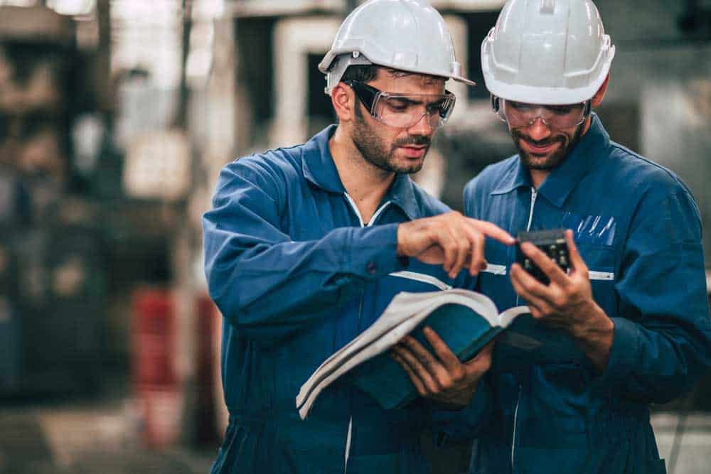 Workers Reading a Manual