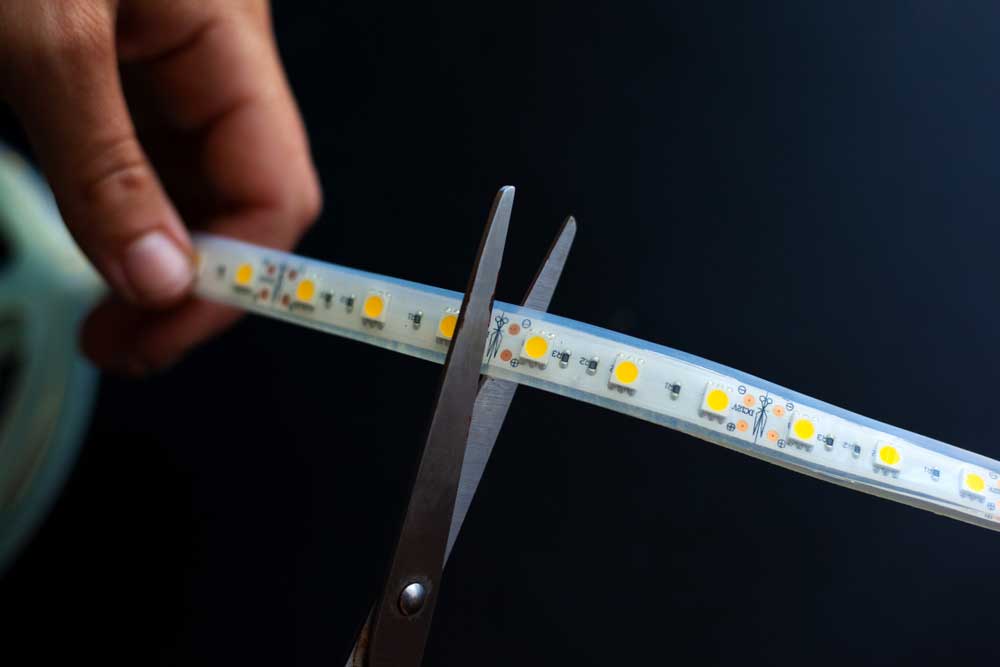LED strip light strimming using a pair of scissors