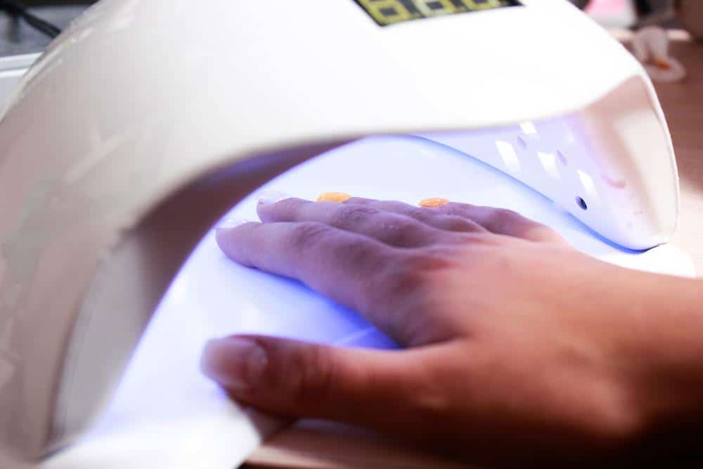 UV lamp for attaching plastic nails with gel method