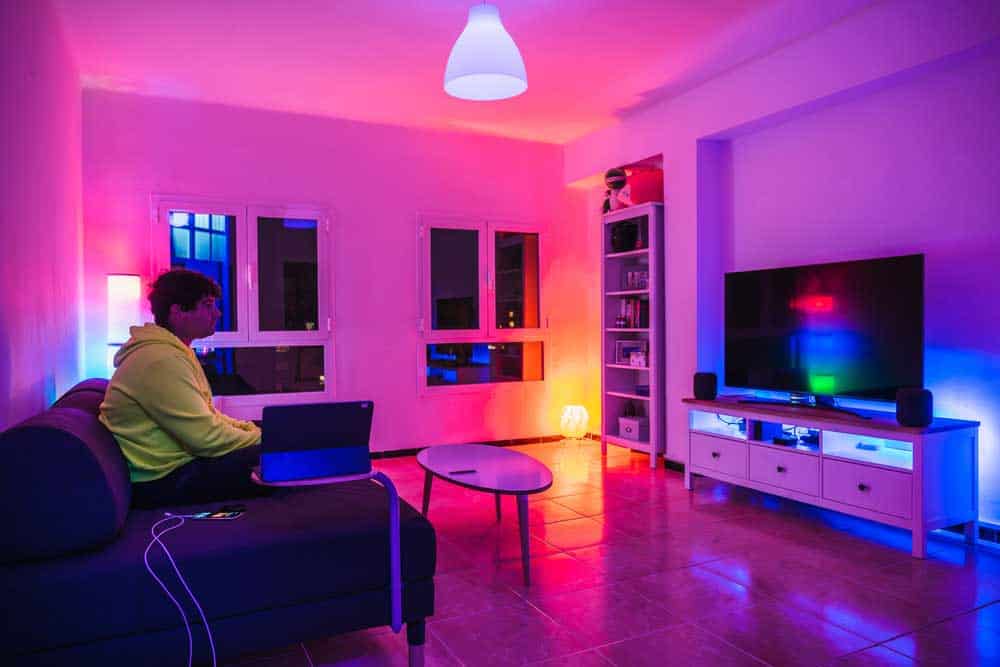 A living room accessorized with multi-colored lights