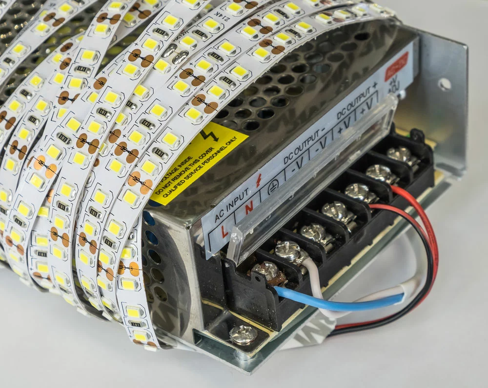 LED strip lights plugged in firmly to a power supply