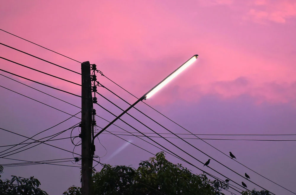 A fluorescent mounted on an electric pole as a street light