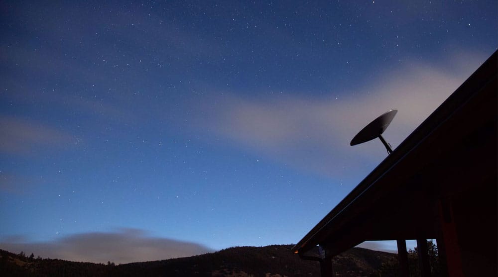 Starlink dish installed outside a home.