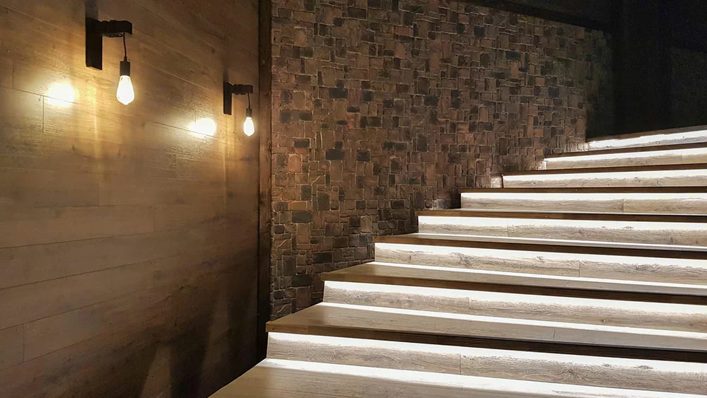 Illuminated staircase with wooden steps