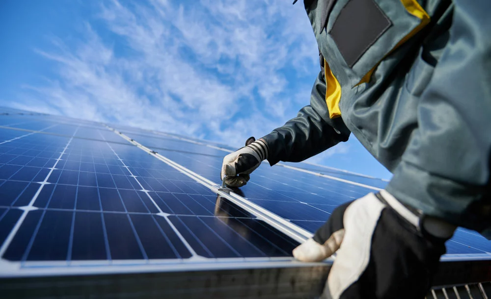 Man is working on solar panels