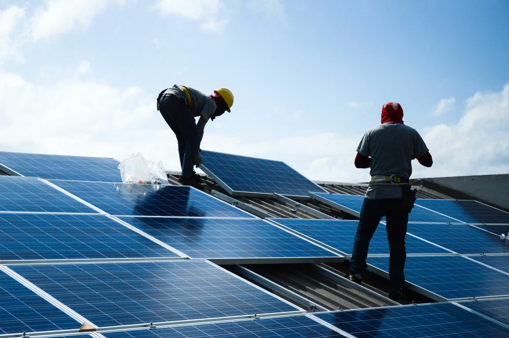 Solar panels being installed on a roof