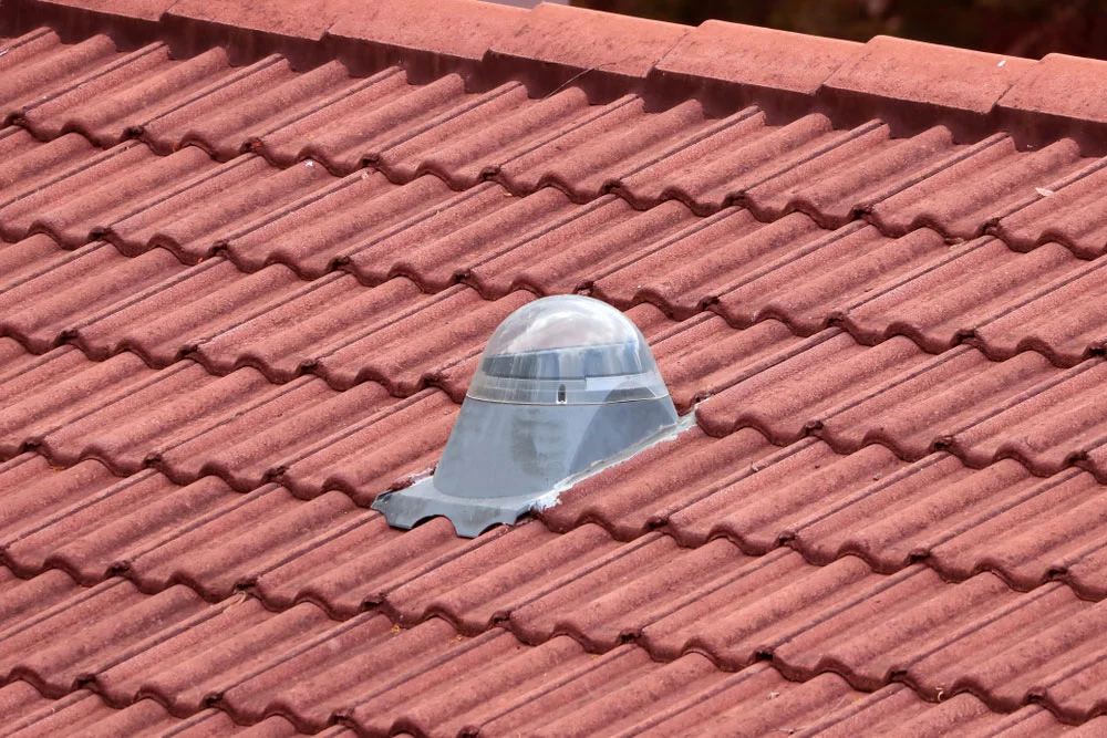 Solar tube on a red ceiling