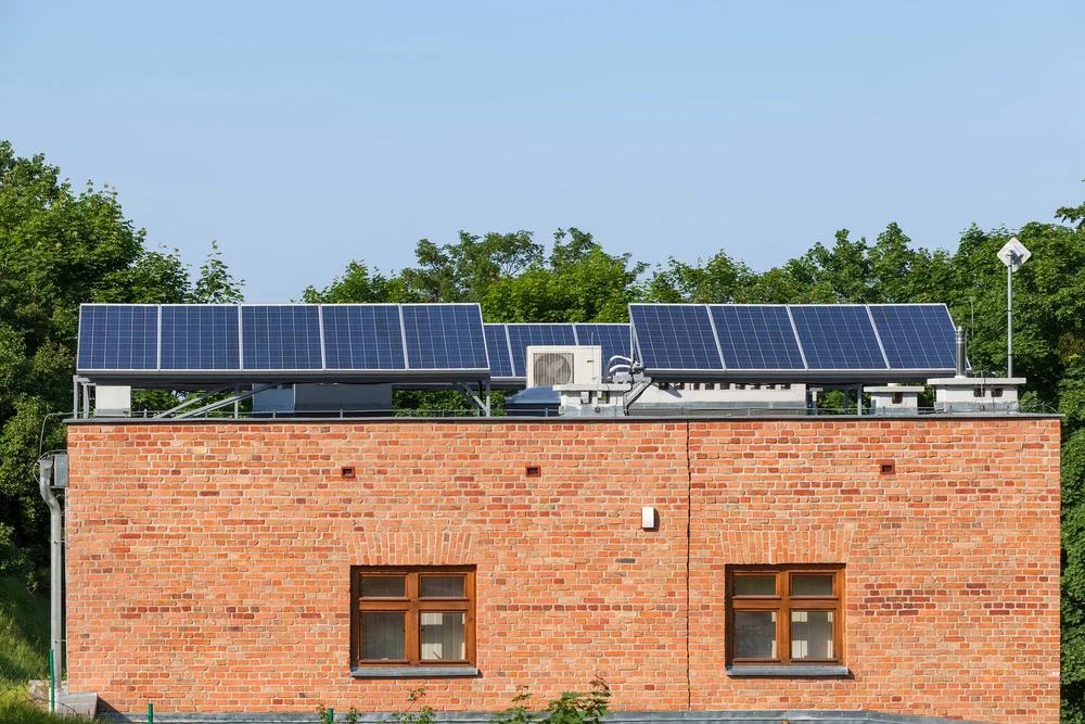 Solar panels and AC units on a rooftop