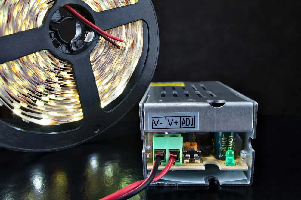 An LED driver connected to an LED strip light on a reel