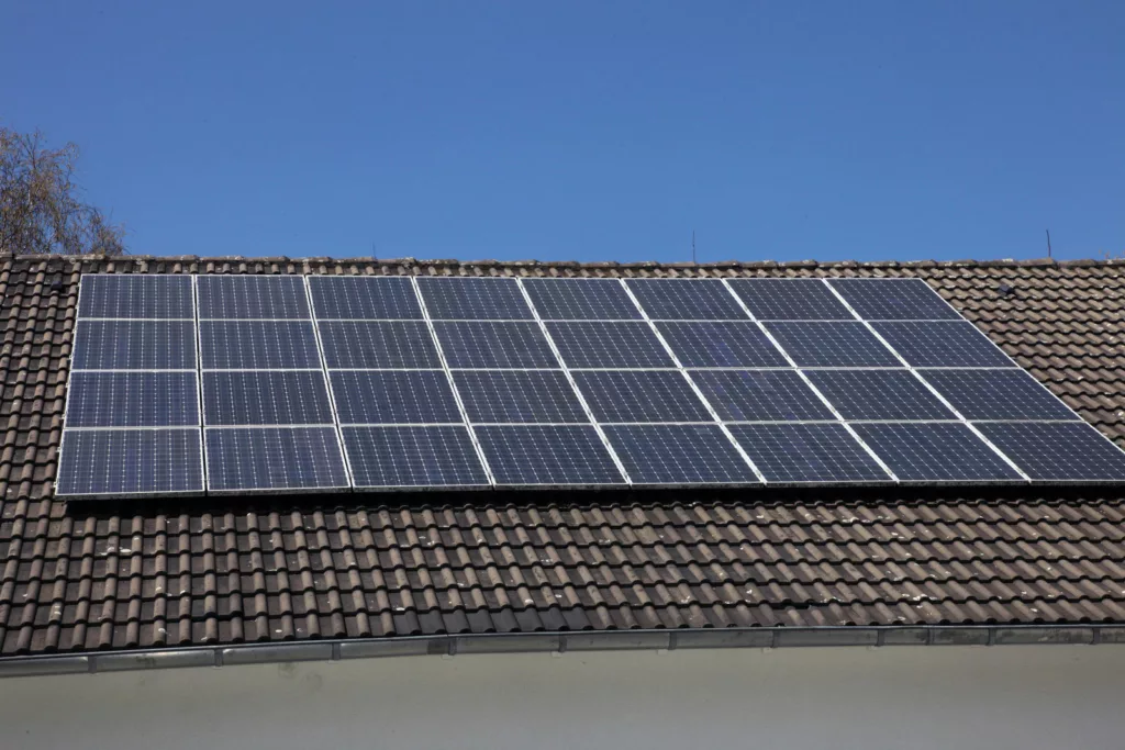 Passive Solar Savings: Solar panels on the roof of a house