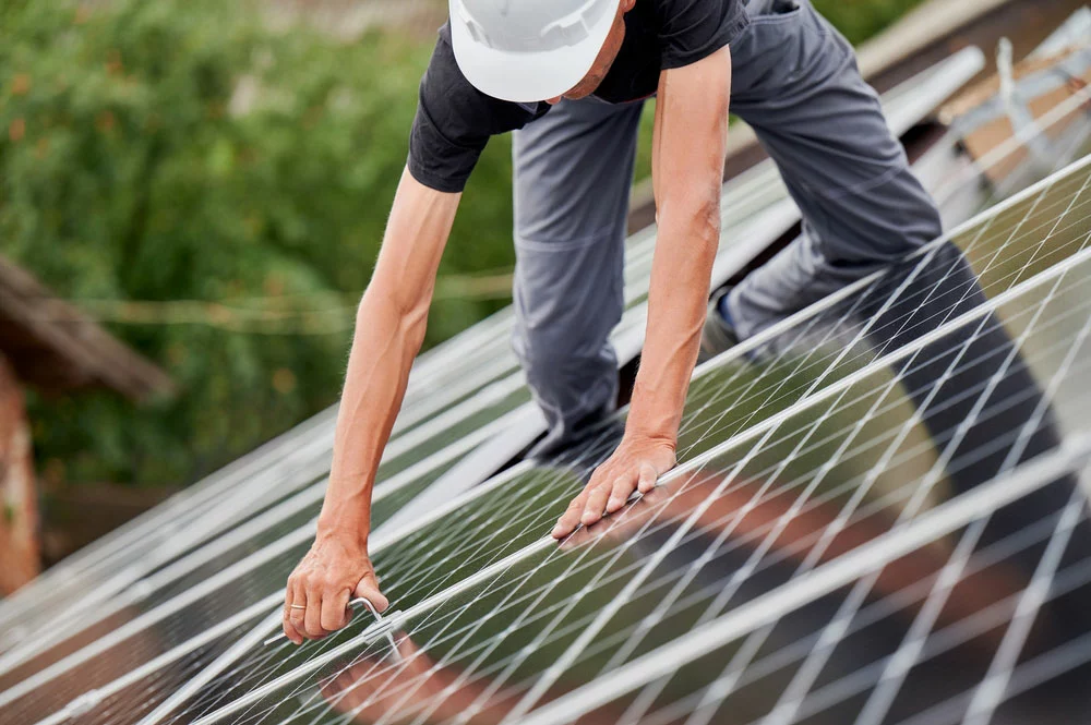 Installer working on steep roof