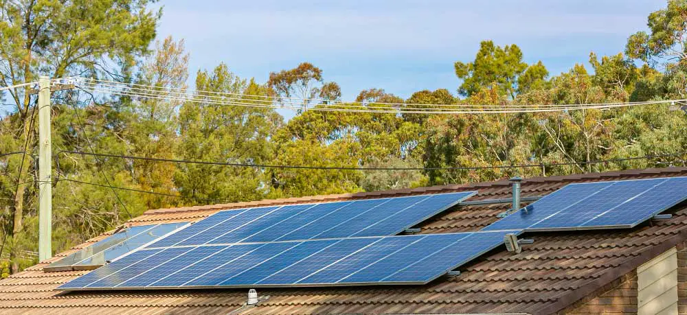 Solar panels on a rooftop under the shade