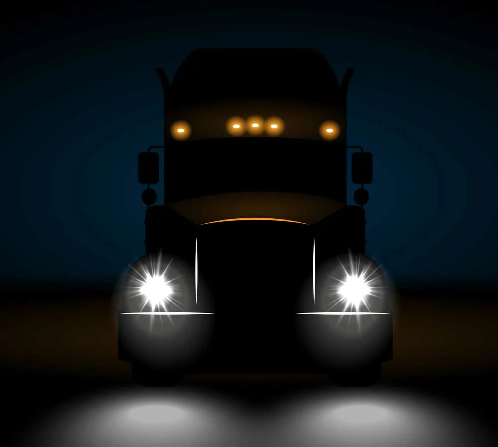 A big semi-truck with clearance lights. Notice how you can know the truck and trailer’s widths just by looking at these lamps.