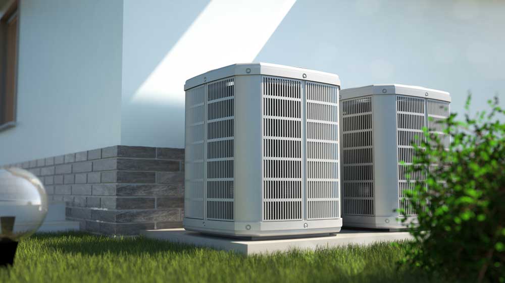 Heat pumps beside a house