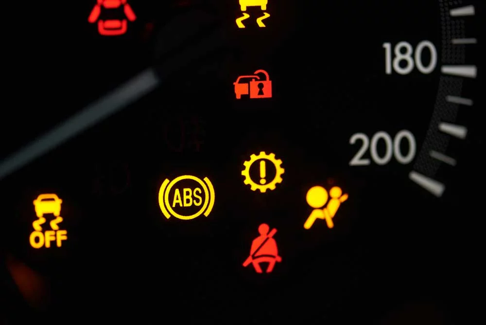 A vehicle dash showing the ABS warning light