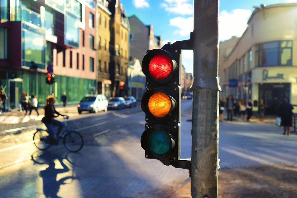 A traffic light with red and orange