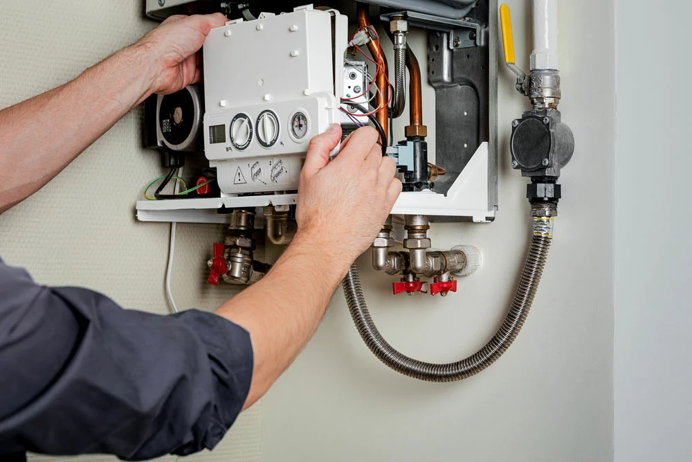 Man repairing a boiler