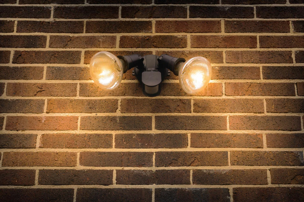 Floodlights on a brick wall