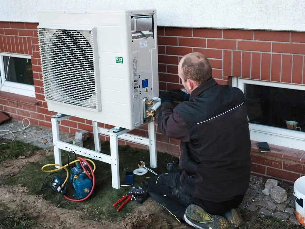 Man installing a heat pump