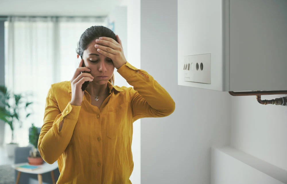 A woman calling for boiler maintenance