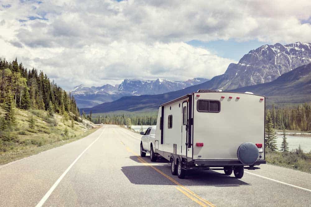 An RV motorhome trailer with red clearance and identification lamps