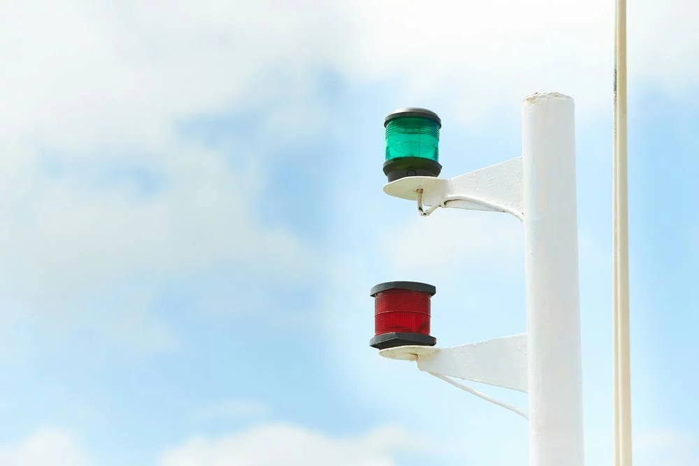 Anti-Collision Lights vs. Position Lights:
Red and green navigation lights on a sailboat