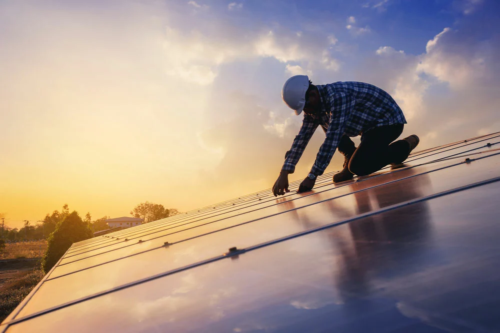 Man installing solar panels