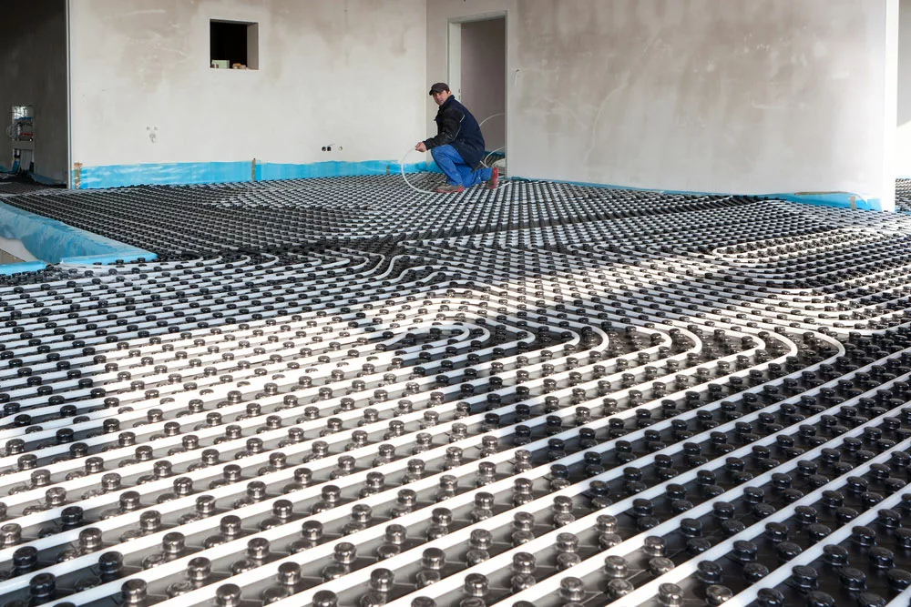 An underfloor heating system installed in a large room