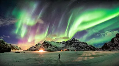 Aurora borealis over a mountain
